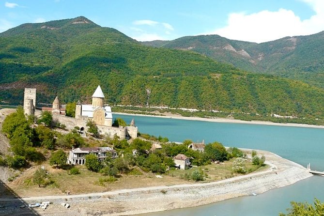 Caucasus mountains full day Private Tour Ananuri-Gudauri-Kazbegi - Zhinvali Reservoir, where a city lies beneath the water