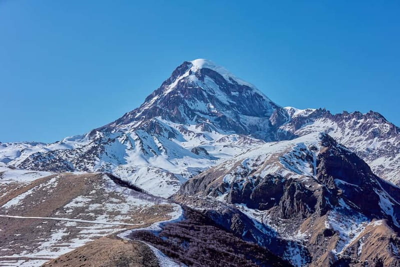 From Tbilisi: Ananuri, Gudauri, and Kazbegi Tour with Guide - Zhinvali Reservoir: turquoise water and a useful first stop