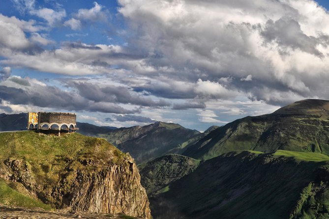 Kazbegi Tour (Group) - The Friendship Monument above the mountain valley