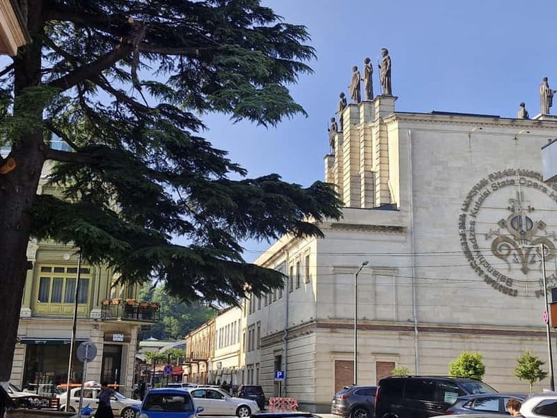 Kutaisi: Guided Walking Tour with Local Snack - Walking Rustaveli Street toward the White Bridge