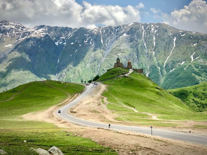 Private day trip to Stepantsminda, Kazbegi Mountains & Sno - Walking the walls of Ananuri Fortress
