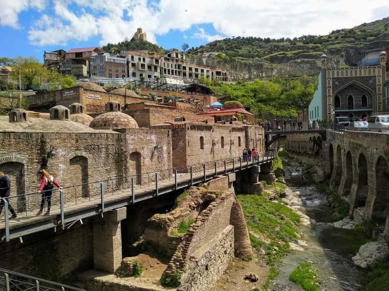 Tbilisi: City Highlights Walking Tour - Walking down to the sulfur bath district