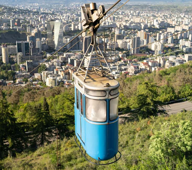 Tbilisi: Old and New City Guided Tour with 2 Cable Car Rides - The Clock Tower and Rezo Gabriadze Theater