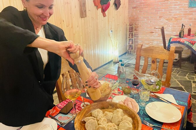 Tbilisi Private Dinner: Georgian BBQ & Fireplace - Folding Imeretian khachapuri