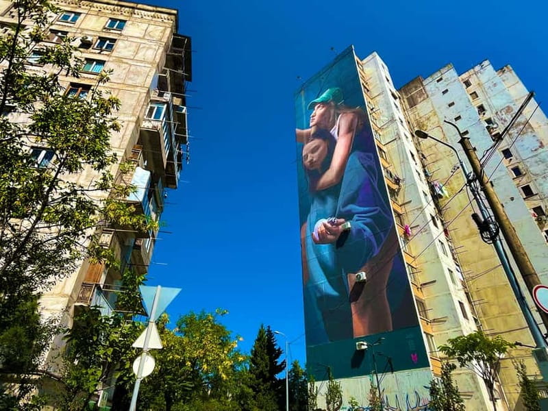 Tbilisi: Soviet Suburbs and Murals Exhibition Guided Tour - The eight-story murals and their international voices