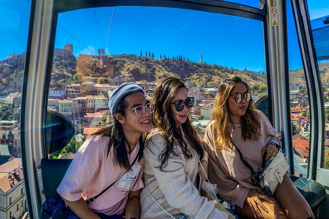 Tbilisi Walking Tour Including Cable Car and Traditional Bakery - Walking back through the Bridge of Peace